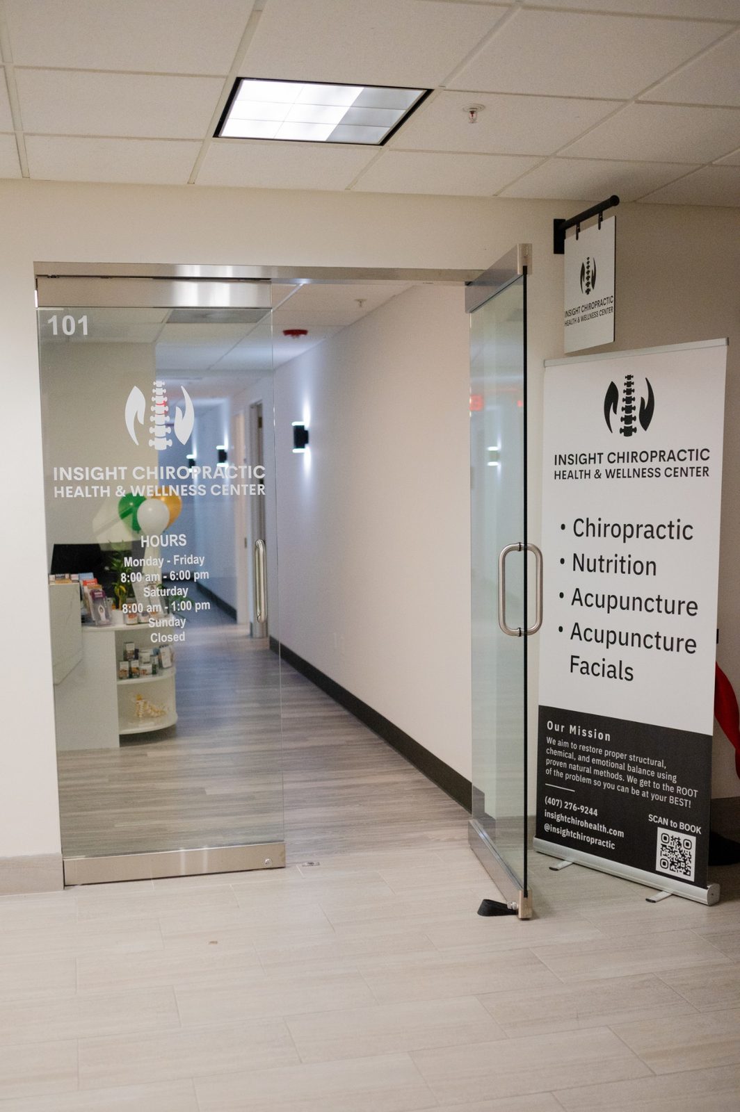 Our entrance — Suite 101, with the Insight Chiropractic Health & Wellness Center logo and hours on the glass door