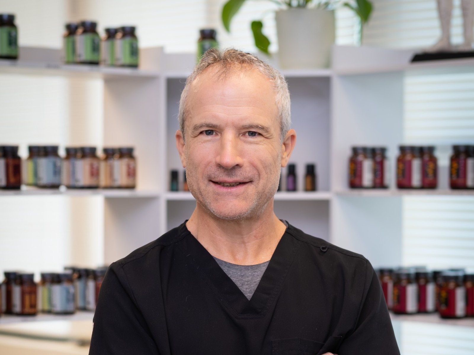 Tim Monaco, AP, LMT, in the clinic's supplement dispensary