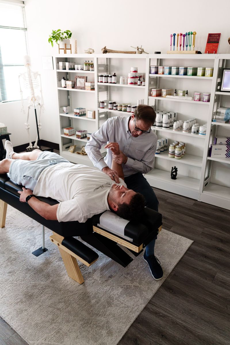 patient receiving chiropractic care from dr olenek